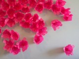 a bright paper floral backdrop – just make some paper flowers and attach them to the wall and voila