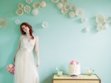 a pastel green wall with doily cups is amazing for a vintage-inspired and romantic wedding