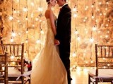 a super romantic and bright lights wedding backdrop is a beautiful idea for any wedding season and any wedding venue