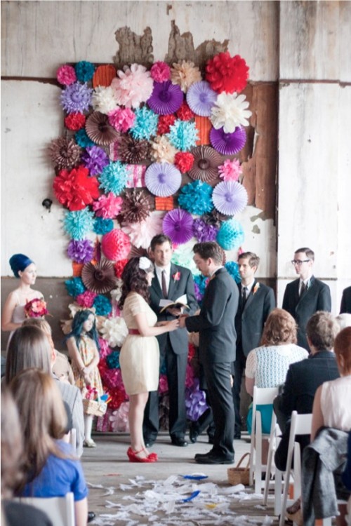 a colorful paper fan wedding backdrop is a very cheerful and fun idea for the couples who love whimsy decor