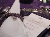 a purple tablecloth, amethyst candle holders and napkin rings look chic and bold, geodes are very trendy
