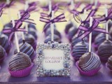 delicious chocolate cake pops with purple liners and purple bows on top