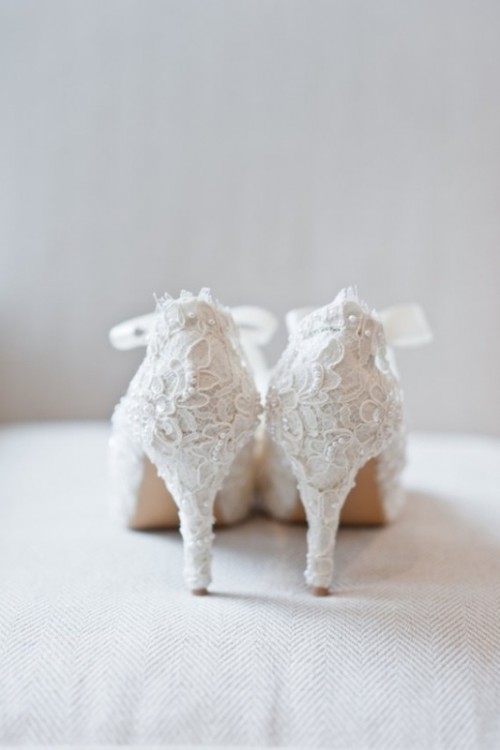 white lace embellished wedding shoes with ribbon are an amazing accessory for adding a chic vintage touch to your bridal look