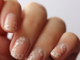 nude nails with white lace detailing are amazing for a refined and chic wedding, they can make your look perfect and delicate