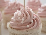 a pink cupcake with sugar pearls and a lace liner plus a small cupcake topper is a lovely idea not only for a bridal shower but also for a wedding