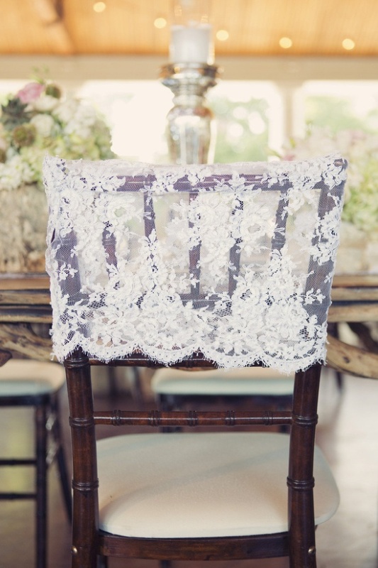 a lace chair cover is a pretty and lovely idea to accent the couple's places or just add a vintage and refined feel to the reception space