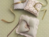lace ring pillows with ribbons are great to show off your rings at the wedding