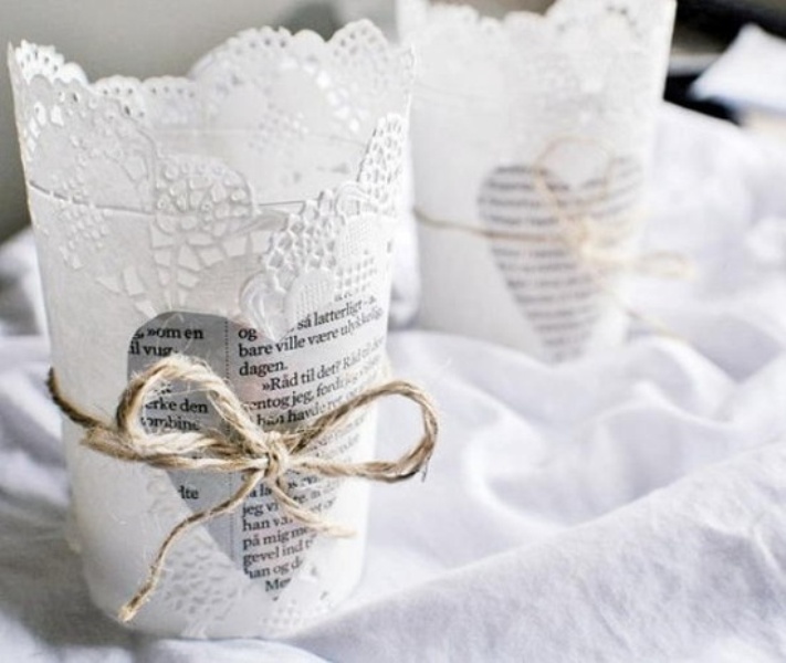 lace candleholders with newspaper hearts and twine are adorable for a vintage wedding, and you may DIY them