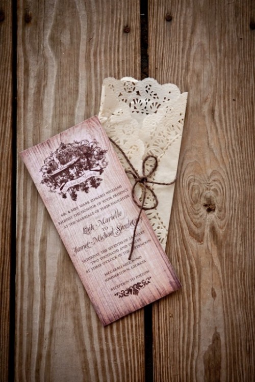 a pink wedding invitation with a print and a lace envelope are adorable for a wedding, they will bring a vintage feel to it