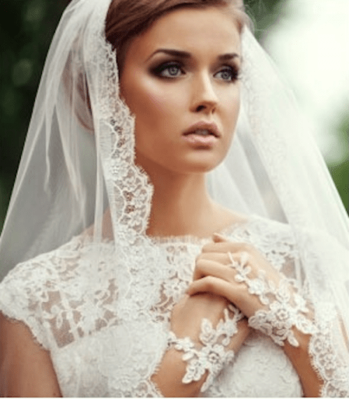 a veil with a lace trim is a traditional accessory for a bride, to add a feminine and very romantic feel to her look