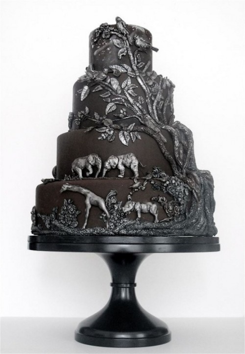 a black wedding cake with dimensional patterns and animals from Africa is a very safari-like idea