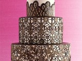 a black and white lace wedding cake with a chocolate bow on top is a very chic idea with a refined feel