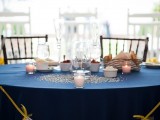 a bunting with letters, candles and sparkling beads right on the table accent it and make it stand out