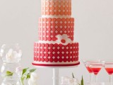 a bright modern wedding cake with an ombre effect, with yellow, orange and red tiers and some sugar blooms is a bold and cool idea for a wedding in summer