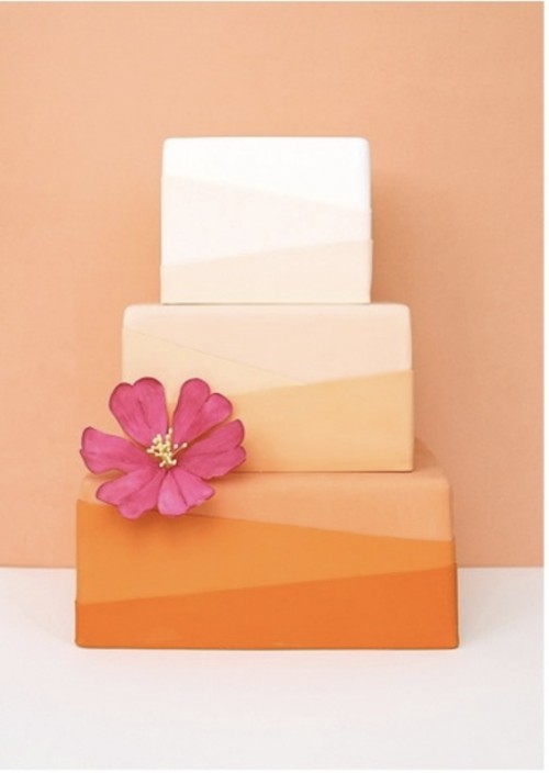 a square wedding cake with ombre tiers, with a bold sugar bloom is a lovely idea for a spring or summer wedding