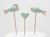 knit mint-colored fish and heart cake toppers are very whimsy and super cute