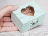 a shabby chic mint box with a cutout heart can be used to display wedding rings or for wedding decor