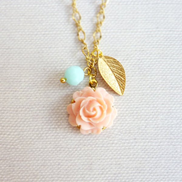 A coral rose, a gold leaf and a mint bead for a cute wedding necklace or as a bridesmaid gift
