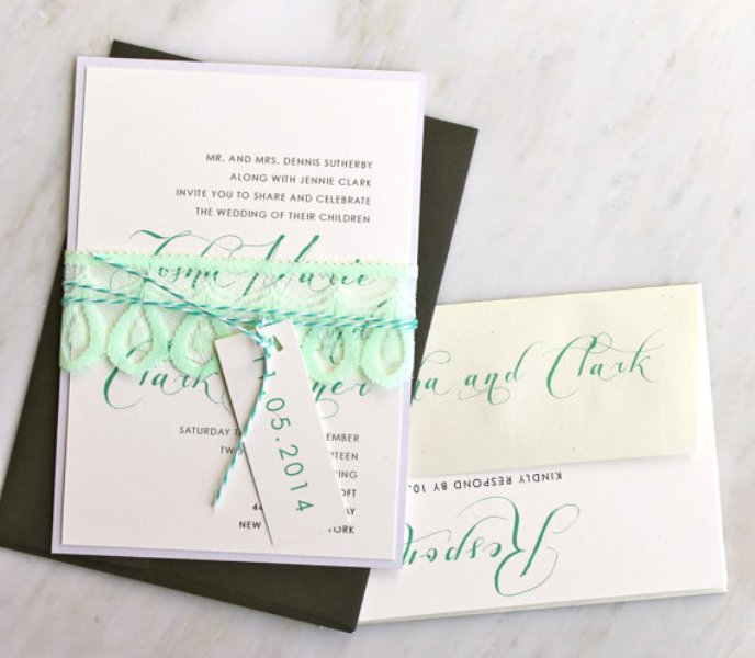 A modern wedding invitation suite with touches of mint is a stylish idea for a modern wedding