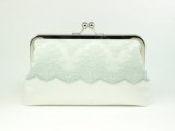 a white and mint vintage-inspired wedding clutch with lace is a chic and romantic accessory for a bride