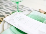 a mint glass plate and a mint glass with a gold rim to accentuate a spring or summer wedding place setting