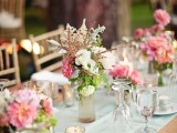 a light mint green wedding table runner looks cool and fresh with bright pink blooms that are centerpieces