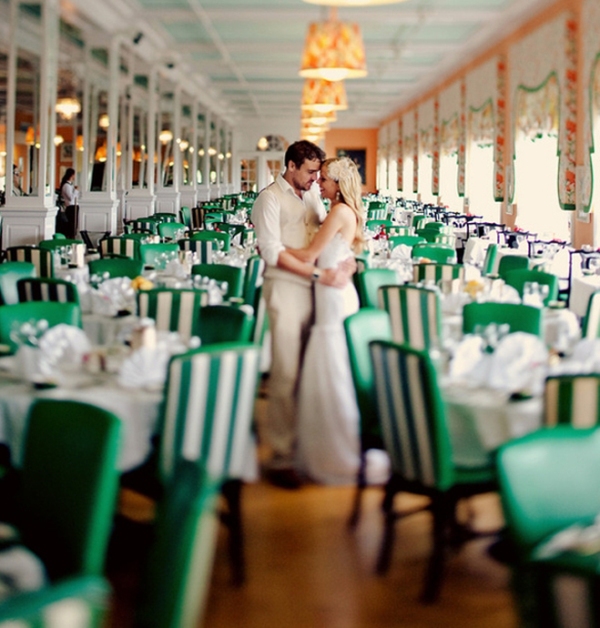 striped emerald and white chairs will make your reception bolder and cooler