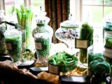 a fully emerald candy table is a bold idea for a wedding, and it adds color