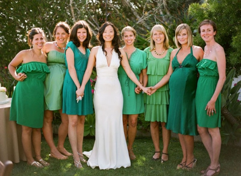 Bridesmaid dresses in various shades of green including emerald will show how to pull of mismatching dresses trend