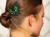 an emerald rhinestone headpiece is a chic accessory for a wedding with emerald touches