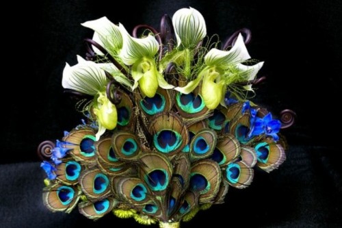 unique blooms paired with peacock feathers make up a chic and bold wedding bouquet