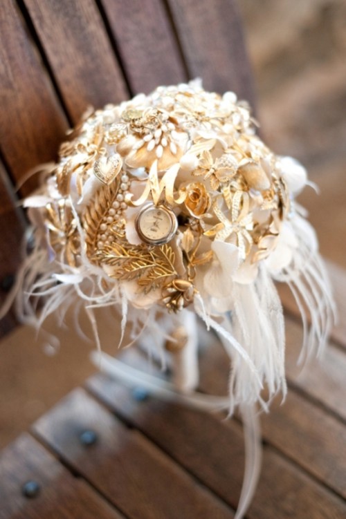 white blooms all covered with vintage brooches, watches and feathers for an art deco bride