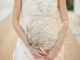 a whitewashed coral branch is a cool idea for a coastal or beach bride
