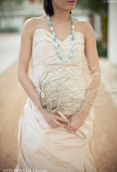 a whitewashed coral branch is a cool idea for a coastal or beach bride