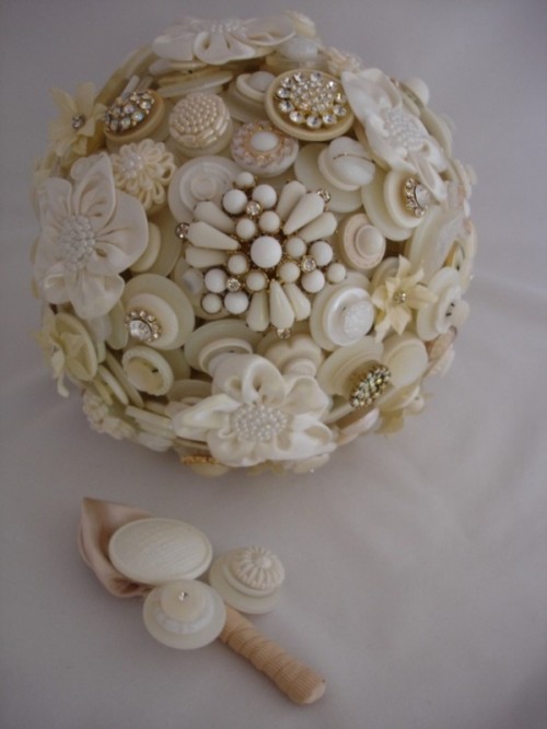 a neutral wedding bouquet of neutral-colored buttons and brooches is a chic idea for a vintage bride