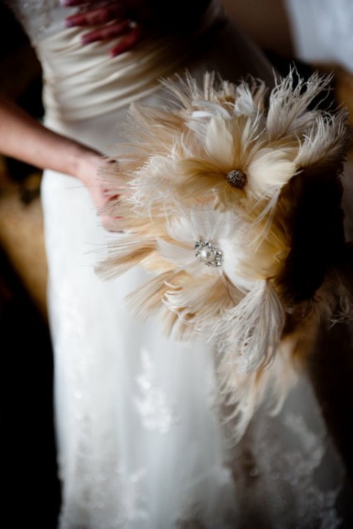 a feather and brooch wedding bouquet is ideal for a vintage bride with a touch of sophistication