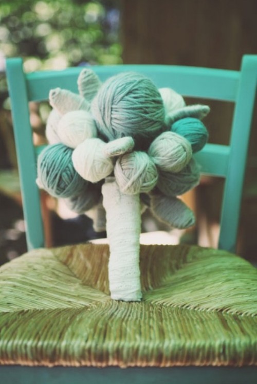a colorful yarn ball wedding bouquet is a fun idea for a rustic or backyard wedding