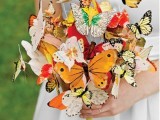 a colorful paper butterfly wedding bouquet is a dreamy and beautiful touch for a fairy-tale wedding