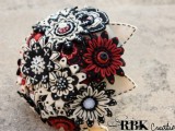 a black, red and white fabric wedding bouquet with buttons and brooches is a bold and fun idea