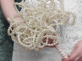 a wedding bouquet fully made of pearls is a very feminine and unexpected idea