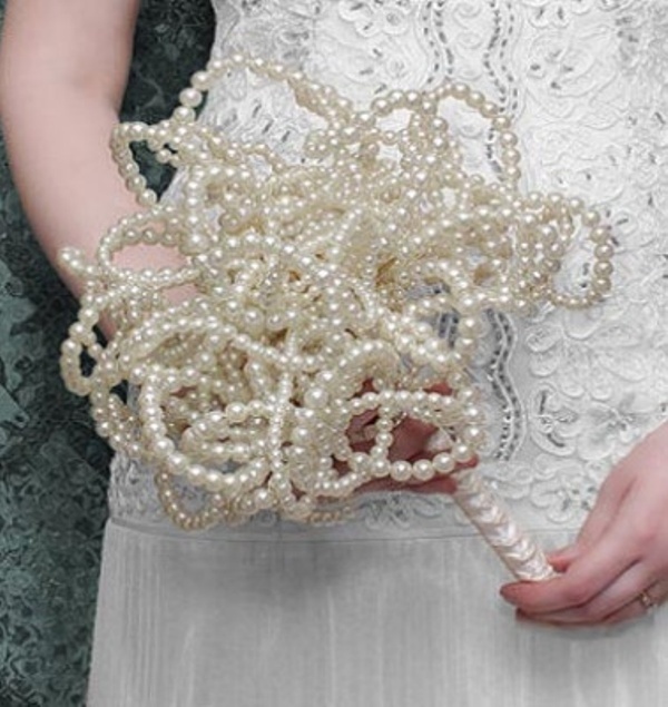 A wedding bouquet fully made of pearls is a very feminine and unexpected idea