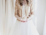 a gold glitter coverup is a lovely idea to add a bit of glam to the bridal look and is very actual for a holiday wedding