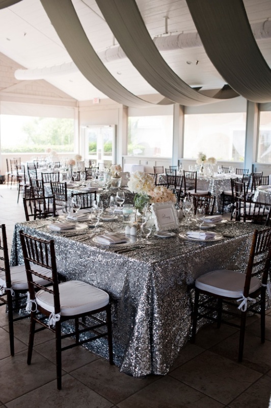 Silver glitter tablecloths are ideal to add a slight shiny glam touch to your reception and make it look cooler