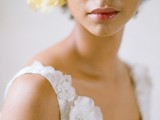 an oversized bold yellow bloom to accent a bridal hairstyle is a lovely idea for a spring wedding