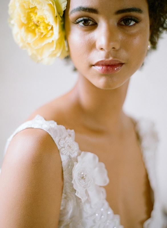 An oversized bold yellow bloom to accent a bridal hairstyle is a lovely idea for a spring wedding