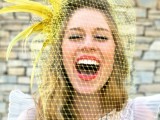 a yellow birdcage veil with feathers is a lovely and bold accessory for a fun spring wedding