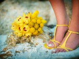 yellow strappy sandals and a yellow wedding bouquet for a bold tropical wedding