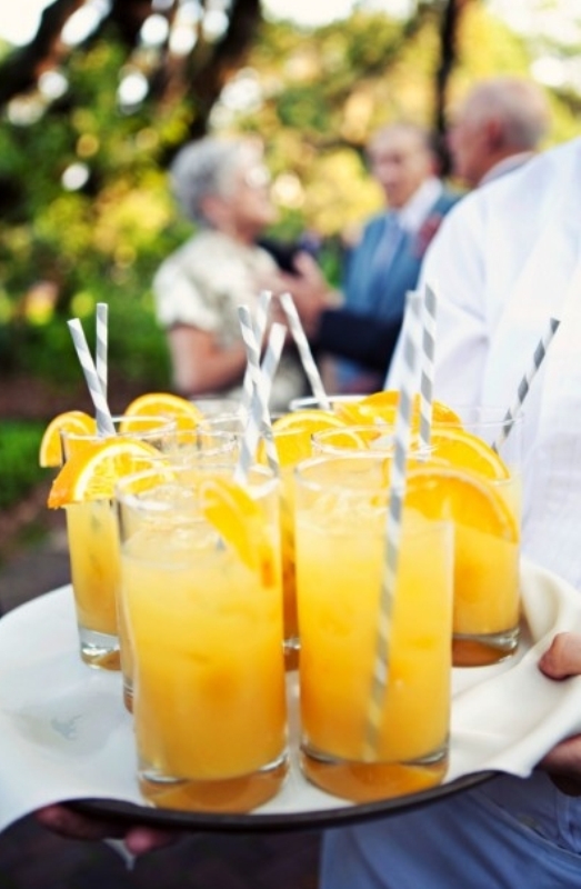 Bold yellow lemonade with citrus slices are a great idea of a refreshing drink at a spring wedding