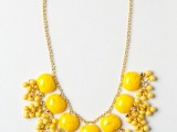 a statement gold necklace with yellow beads and stones is a gorgeous idea for a spring or summer bride