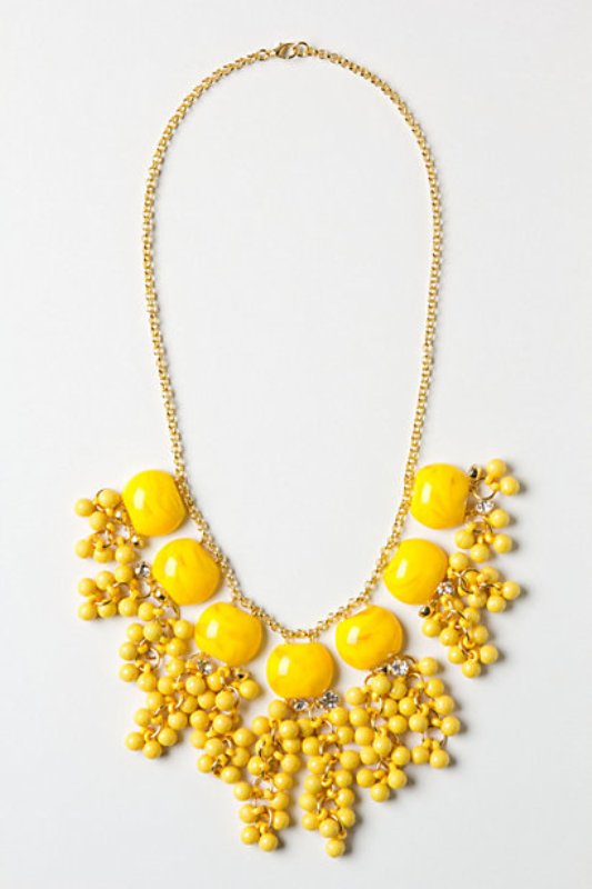 A statement gold necklace with yellow beads and stones is a gorgeous idea for a spring or summer bride
